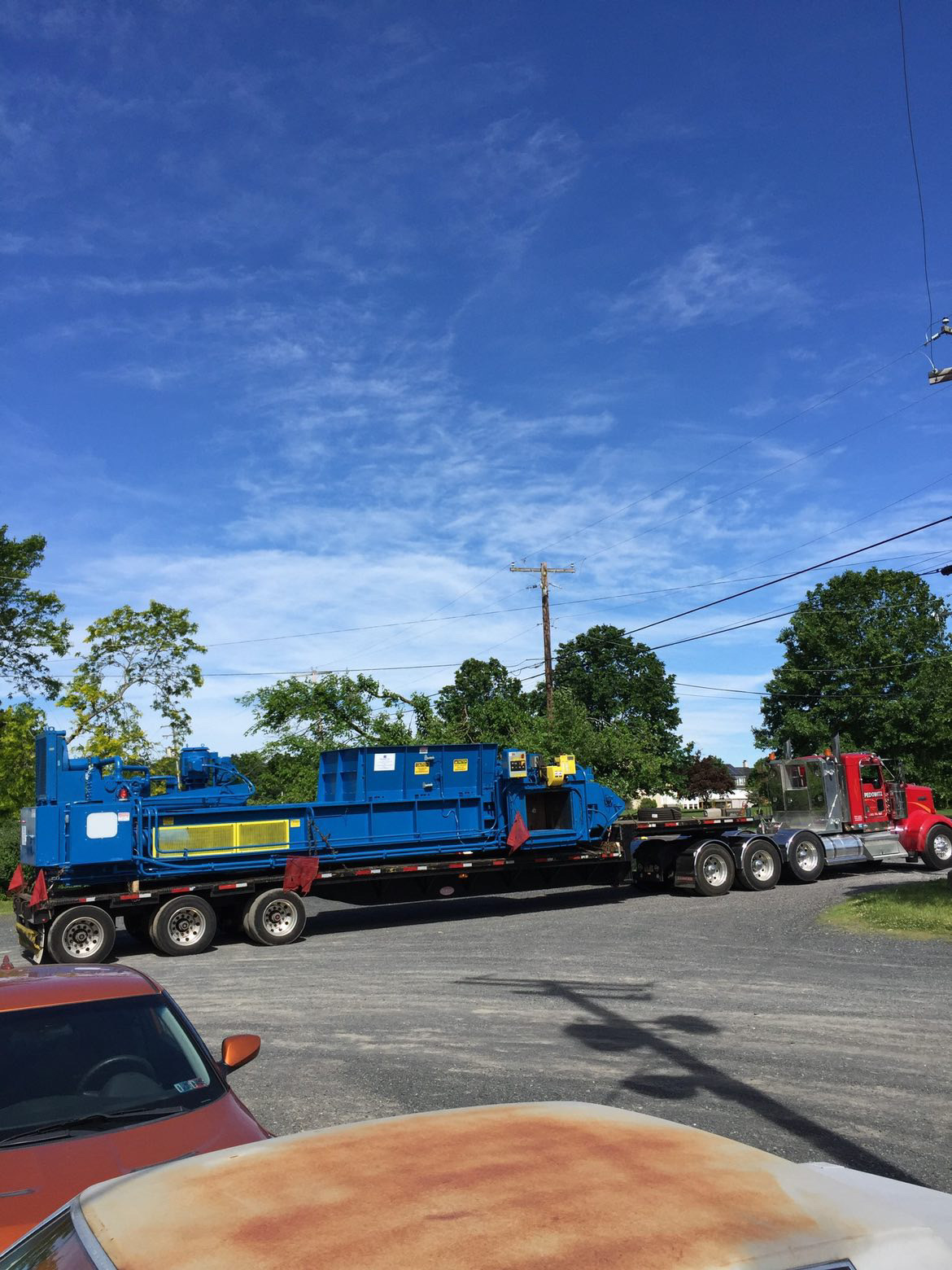 Pedowitz Machinery Movers Best Oversize Load Transport Trucking & Rigging Company NJ Irregular Dimension Trash Bailer 1